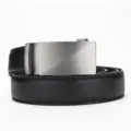 Detail shot of a men's black leather belt featuring a brushed silver automatic buckle. - PD1683 Lychee Pattern / 110cm / Black