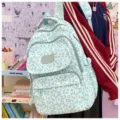 Mint green leopard print backpack for students, featuring a large capacity and multi-pocket design. - Green