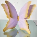 Close-up view of gradient purple 3D paper butterfly art prop for wedding event decoration. - Purple-Yellow Gradient