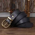 Detail shot of vintage black leather belt with distressed brass pin buckle texture. - 100cm / Black