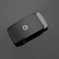 Close-up detail of a glossy black zinc alloy automatic belt buckle with a G logo - External Threading Style / Gunmetal