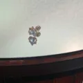 Macro view of a 316 titanium steel ear bone stud featuring a heart-shaped blue zircon - Heart of the Ocean (A8)