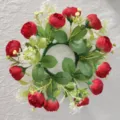 Detailed top-down view of a red artificial tea rose wreath with delicate white baby's breath - Red