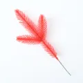 Close-up of artificial red pine branch for Christmas DIY decoration and floral crafts - 1 Piece / Single Red Pine Branch