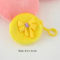 Süße gelbe Plüsch-Mini-Geldbörse mit dekorativer Schleife, tragbare Kopfhörer-Tasche - 8.4x8cm / Gelb