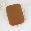 Portable brown pocket compact mirror with rounded rectangular design for daily makeup use. - Brown