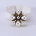 Close-up detail of a vintage palace style cross brooch with teardrop pearls and crystals - Vintage Gold White Teardrop Pearl Cross / Style 3