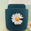 Wall-mounted punch-free storage box with a white daisy pattern in dark teal finish. - Wild Daisy / Blue