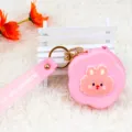 Cute pink flower-shaped silicone coin purse with rabbit character and wrist strap - Honey Rabbit