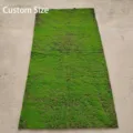 Full view of rectangular artificial green moss turf roll on plain floor background - 3D Brown Base Green Moss