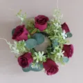 Artificial eucalyptus candlestick wreath with dark red roses, perfect for holiday home decor. - Burgundy