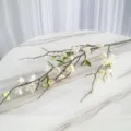 Elegant white artificial plum blossom branch with green leaves for home living room decor - White
