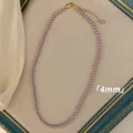Dettaglio collana di perle rosa-viola da 4mm con chiusura regolabile in oro - Collana / 4mm / Viola