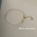Detailansicht einer 3mm hellrosa Perlenkette mit einem klassischen goldfarbenen Verschluss - Armband / 3mm / Rosa