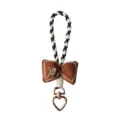 Handmade brown embroidered fabric bowtie keychain with braided rope loop and heart clasp - Brown