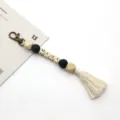 Boho-Schlüsselanhänger aus Holzperlen mit MAMA-Buchstaben und cremefarbener Quaste - 20cm / Schwarze Perle