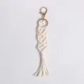 Handmade boho macrame keychain crafted from white cotton rope featuring a gold cross charm - Style A / 21cm
