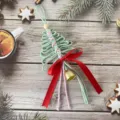 Handmade green macrame Christmas tree ornament with red bow on rustic wood - 30cm/11cm / Bean Paste Green