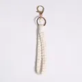 Handmade off-white macrame cotton rope keychain featuring a small gold cross charm - Style E / 21cm