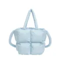 Minimalist light blue puffer tote bag with quilted padding and soft handles for winter - Blue