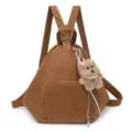 Brown leather backpack with triangular design and teddy bear charm. - Single Bag / Khaki