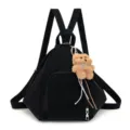 Stylish black women's triangular backpack featuring a cute fluffy teddy bear charm. - Single Bag / Black