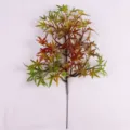 Detail view of artificial maple leaf branch with autumnal gradient colors. - Maple Leaf / Green & Brown