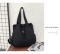 Black nylon convertible backpack and tote bag with drawstring closure and casual daily style. - Black