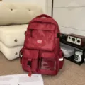 Red camouflage large capacity backpack, casual student schoolbag for daily commute. - Red