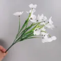 Detailed macro view of artificial white flowers with five stems for wedding decor - White