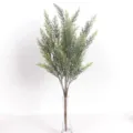Artificial green pine needles detail view in a transparent glass vase for home decor - 45cm / Long Green With Snow