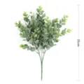 Close-up detail of artificial eucalyptus branch with frosted green leaves for decor. - Small Double Green With Pink