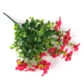 Close-up of vibrant red artificial flowers with green eucalyptus leaves on white - Rose Red