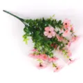 Detailed view of artificial pink flowers with green eucalyptus leaves on white background - Pink