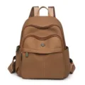 Solid brown minimalist travel backpack with textured fabric and multi-pocket design - 9 / Brown