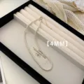Detailed view of an elegant 4mm white pearl necklace displayed on a jewelry tray - Necklace (A72)