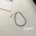 Detail view of a 4mm small purple pearl bracelet with adjustable gold clasp - Bracelet (A81)