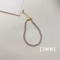 Dettaglio elegante di una collana di perle viola da 3mm con catenina dorata fine - Bracciale (A80) / 3mm / Viola