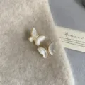 Close-up detail of vintage French butterfly earrings with white mother-of-pearl - Gold Mother Of Pearl Butterfly Studs (R2252)