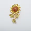 Detailed view of elegant vintage sunflower brooch with yellow and green crystal rhinestones - Citrine + Brown Rhinestone