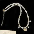 Elegante collana di perle con ciondolo a farfalla e ciondoli a cuore in zircone lucente - Collana di perle a farfalla / Oro