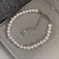Elegant pink pearl and rhinestone beaded bracelet displayed in a soft gray velvet box. - R0343 Rose Style