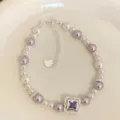 Handmade pink and white pearl bracelet featuring a purple zircon square and heart charm - Heart Pendant Purple Zirconia Style (R5392) / Purple