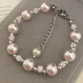 Elegant pink pearl bracelet with sparkling zircon spacers presented on gray velvet box - Manta Artificial Pearl Bracelet (R1430) / Pink