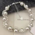 Elegant pearl bracelet featuring pink heart zirconia and a silver heart charm - Cat Paw Artificial Pearl Bracelet (R5518) / White