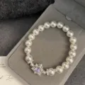 Elegant pearl bracelet with a pink heart-shaped zircon pendant in a grey gift box - Purple Heart Zirconia Artificial Pearl Bracelet (R3077) / Purple
