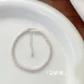 Detailed macro shot of elegant 2mm mini pink pearl bracelet with silver clasp and chain - Bracelet / 3mm / Manta Purple