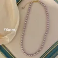 Elegant 6mm purple pearl necklace for women featuring an adjustable gold-toned chain - Necklace / 6mm / Purple
