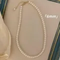 Refined 6mm white pearl necklace featuring a gold-plated clasp and adjustable chain - Necklace / 6mm / White