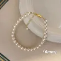 Elegant French style 6mm pearl bracelet with a gold-tone lobster clasp for women - Bracelet / 6mm / White